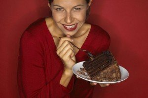 Woman eating a chocolate cake