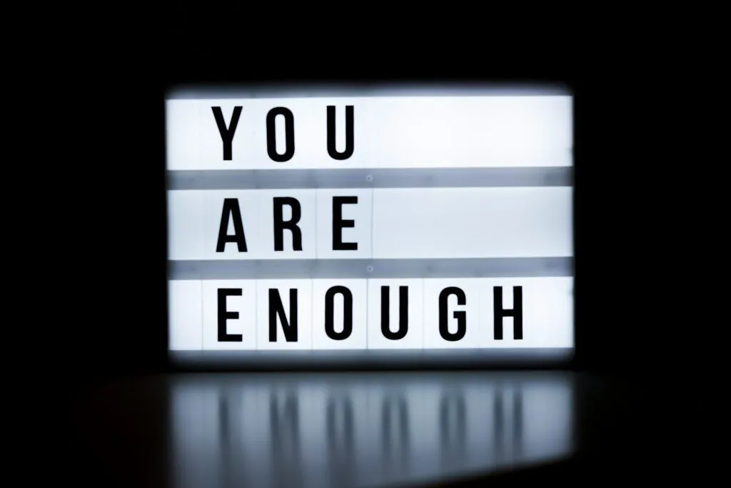 frase motivazionale testo al neon you are enough